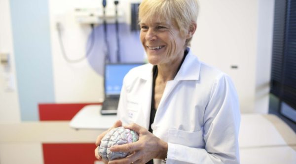 CHOC epileptologist Dr. Mary Zupanc holds a model of a human brain..