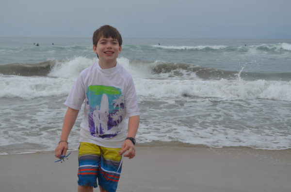 CHOC Children's Neuroscience Institute patient Gabriel Lucak poses by the ocean